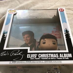 Elvis Funko pop new in box with plastic case item is showed with Christmas cover